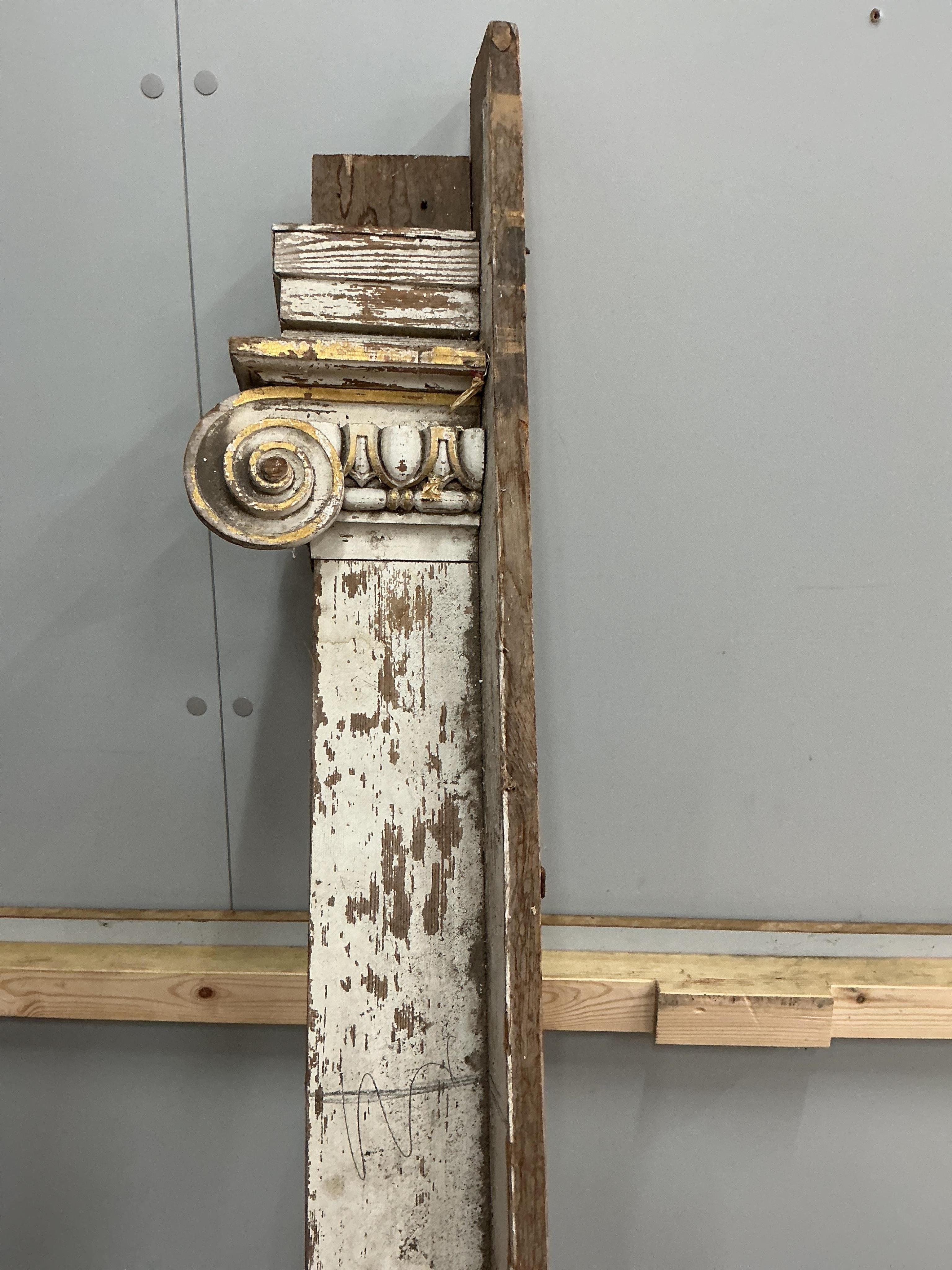 A large late 18th century painted parcel gilt pine door surround, width 154cm, height approximately 266cm